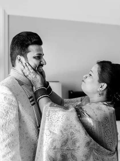 A beautiful black and white photo of Aakash and his mother. Her expression of love and pride as she helps him get ready is priceless.