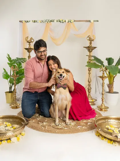 A couple and their dog posing happily in our Diwali setup. These mini-sessions are a quick and easy way to get a beautiful family portrait for the holidays.