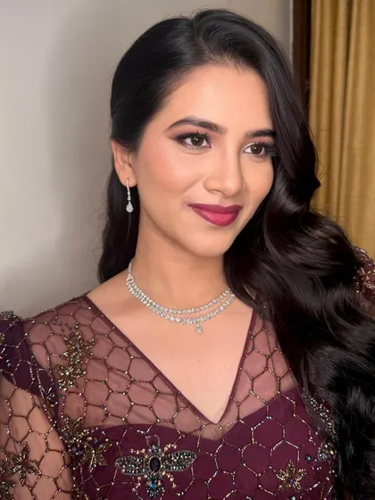 A bold and beautiful cocktail look. The deep berry lip and defined eyes are perfect for an evening party.