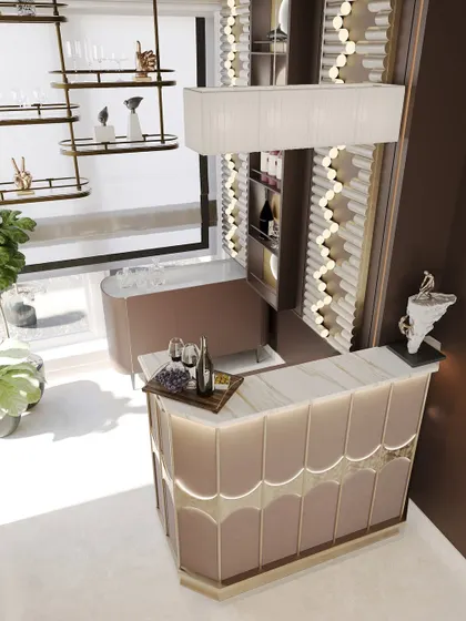 An overhead view of the bar, showcasing the elegant, curved counter with custom paneling and integrated lighting. The palette is a soft, inviting pinkish beige.