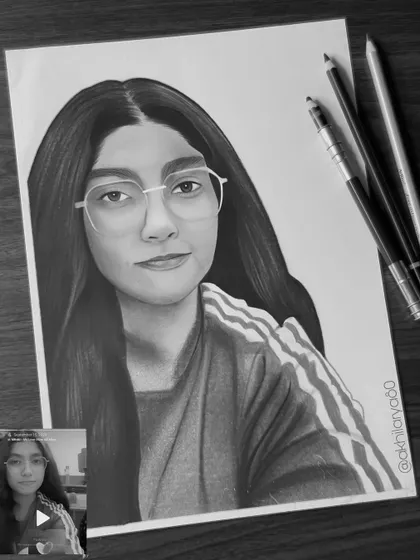 An A4 graphite sketch of a girl with glasses. I take care to draw glasses realistically, capturing reflections and ensuring they look natural on the face.
