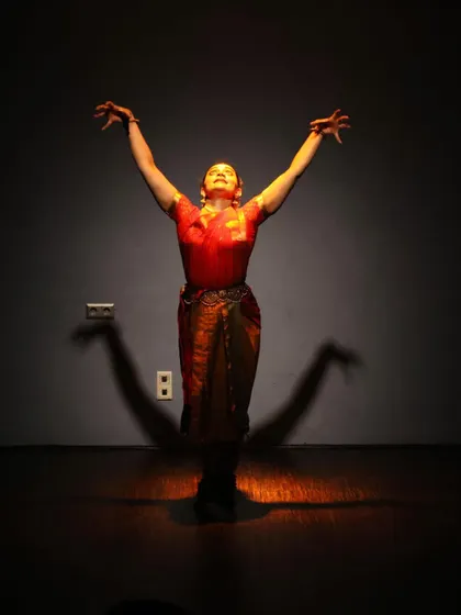 A powerful and dramatic pose from the "Varkari" performance in Berlin, a city with a vibrant arts scene.