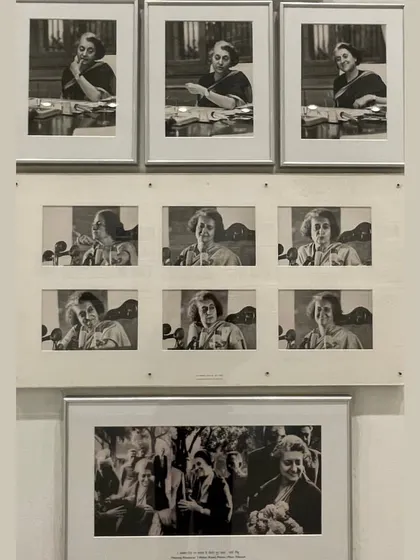 A collection of black and white photographs capturing various moods and moments of Indira Gandhi at her desk. This display personalizes a powerful political figure, showing her in moments of contemplation, work, and engagement.