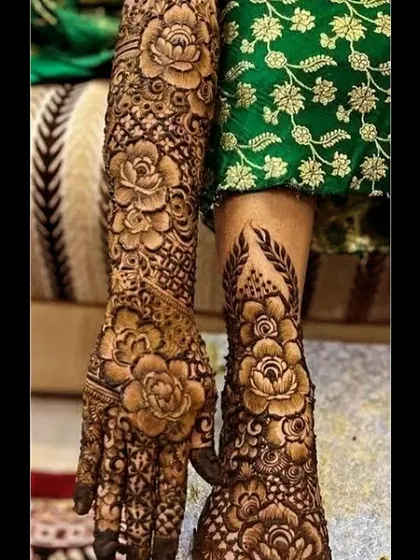 A close-up of the bold rose motifs that are very popular with modern brides. This design combines the softness of florals with the intricacy of traditional Indian mehendi patterns.