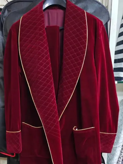 A close-up of the custom-made velvet robe. The quilted detailing on the lapel and the fine gold piping are the small touches that elevate a costume from just clothing to a piece of character art.