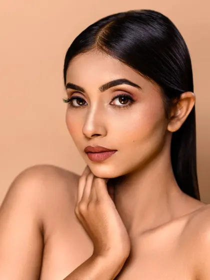 A classic headshot with a focus on the model's natural beauty. The simple lighting and composition make this a versatile shot for an actor or model's portfolio.