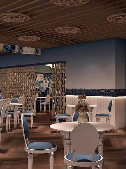 A restaurant design concept with a charming blue and white theme. The space uses classic furniture, patterned ceiling details, and elegant archways to create a welcoming and stylish dining experience.