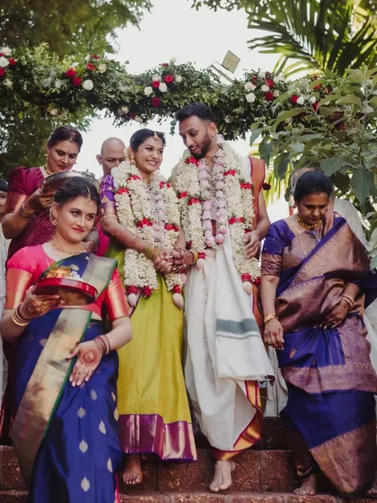 The couple's exit, surrounded by family and blessings. We orchestrate these moments to feel both grand and intimate, creating a perfect conclusion to the wedding ceremony.