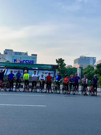 The group posing at a bus stop, a familiar sight on our long rides.