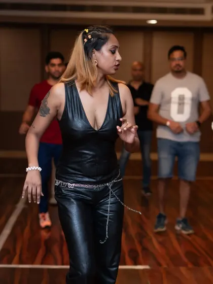 A candid shot from a workshop, where I'm demonstrating a move. I love interacting with my students and providing individual feedback.