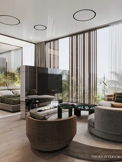 Functionality meets high design with this custom rotating television unit. Clad in reflective, high-gloss panels, it serves as a dynamic partition between the sleeping and seating areas of the bedroom, offering entertainment without compromising on aesthetic flow.
