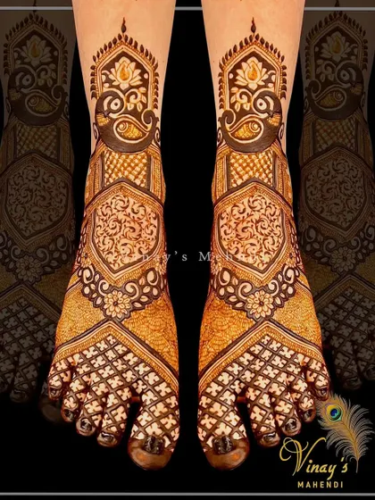A geometric style of bridal feet mehndi. The design uses sharp lines and repeating patterns to create a modern yet traditional look.
