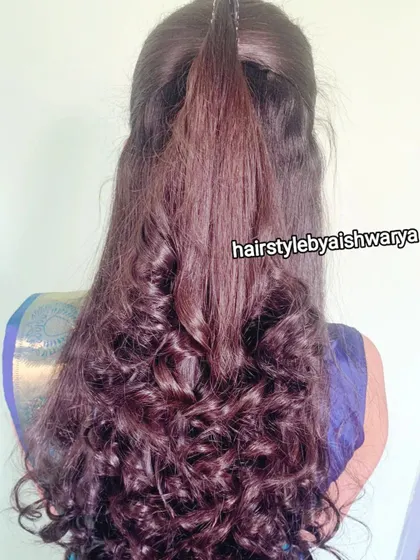 A simple yet chic hairstyle with curls only at the ends. This is a great option for adding a touch of glamour without being too over the top.
