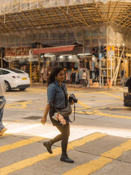 Walking across a street in Hong Kong, camera in hand. The light was just perfect, and it's true what they say, "videsh ki dhoop hi alag hai" (the sunlight abroad is just different).