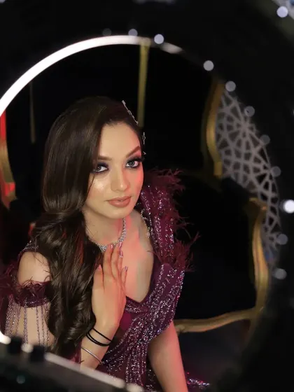 A creative bridal portrait using a ring light to frame her face. This modern technique creates a glamorous, studio-like effect that makes the bride the star of the show.