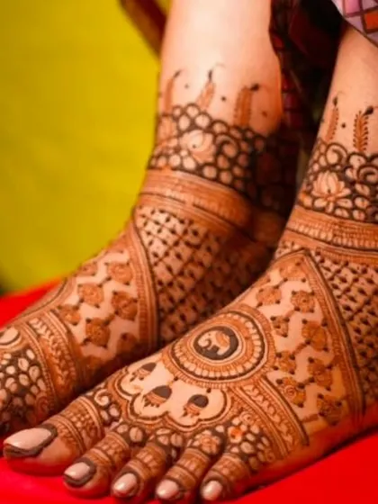 A classic foot design with a central mandala and intricate patterns covering the toes and ankle. This is a timeless choice for any bride.