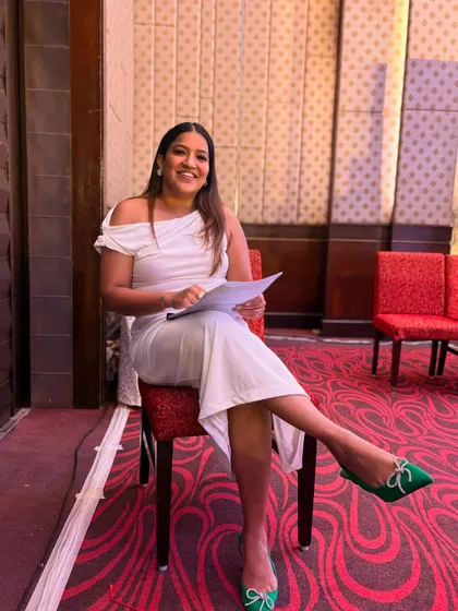 Backstage at the Pharma & Med Devices Conclave, reviewing my notes. Preparation is crucial for a flawless execution.