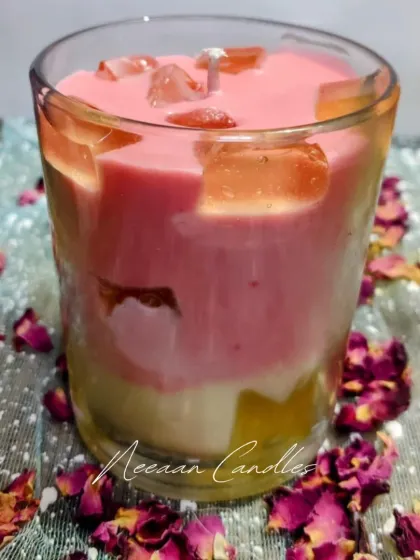 Layered with love and topped with charm, this handcrafted soy candle is a treat for the senses. The different colored layers and crystal toppings make it truly special.
