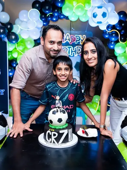 I love capturing the energy of kids' birthday parties. For this 9th birthday, we went all-in on a football theme, complete with a custom cake and decorations, creating a fun and memorable shot for the whole family.