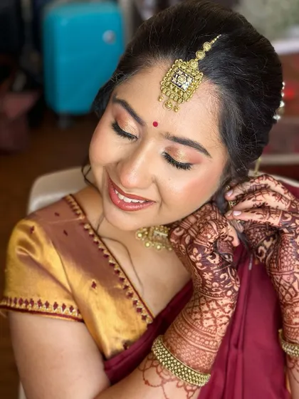 A doll-like bride getting ready for her engagement. I used soft, warm tones on her eyes and cheeks to create a youthful and radiant glow.