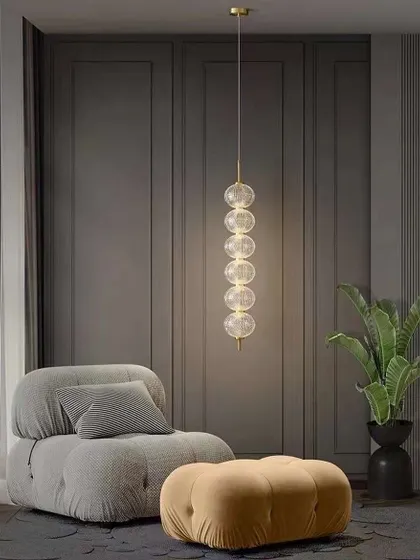 A vertical stack of clear glass globes creates this simple yet beautiful pendant. It's ideal for a corner or next to a comfortable chair.