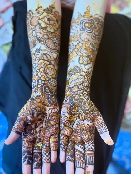 My signature floral henna, featuring a mix of bold roses and delicate patterns for a stunning bridal look.