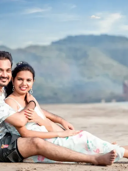 A relaxed and happy portrait of a couple enjoying their time on the sand. This kind of comfortable, smiling shot is perfect for capturing the easy-going love they share.