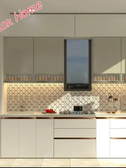 A two-tone kitchen with a geometric-patterned backsplash. The design includes space for a washing machine, showing our ability to create integrated utility areas.