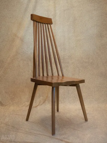 A full view of the 'Alto' dining chair. Its high back and sturdy construction make it a comfortable and durable choice for everyday use.