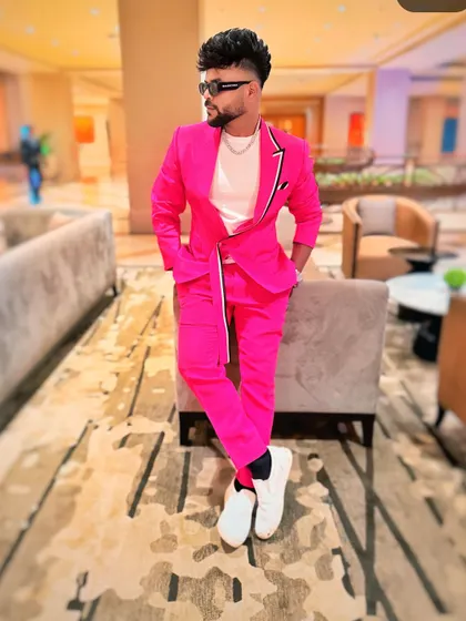 Another look at the sharp tailoring of this pink suit.