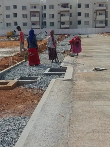 This photo from a project site shows the installation of the subsurface drainage system along a new road. Proper water management is a fundamental part of our site planning to ensure the long-term health and stability of the landscape.