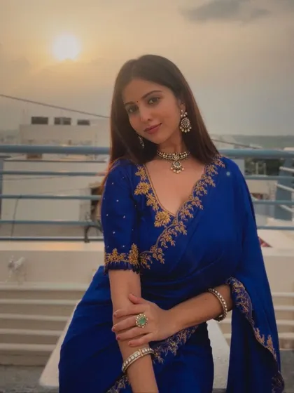 A close-up of the client in her royal blue saree, taken during sunset for a beautiful glow.