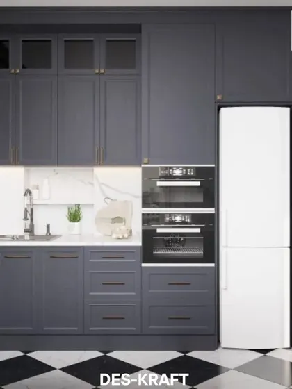 A full view of the kitchen's appliance wall, with integrated ovens and a refrigerator seamlessly built into the dark, elegant cabinetry.