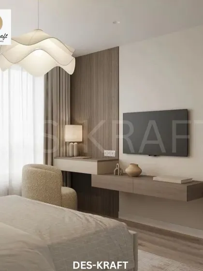 A modern bedroom featuring a floating vanity, a unique wave-form pendant light, and a soothing neutral color scheme for a calm and uncluttered retreat.
