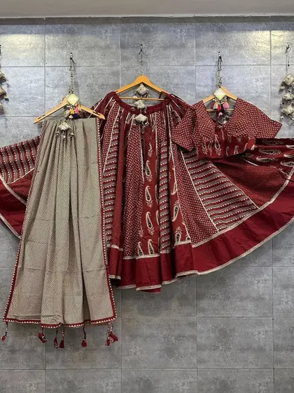 A beautiful maroon and beige set with traditional Ajrak print. This outfit has a classic, earthy feel and is perfect for an elegant Navratri look.