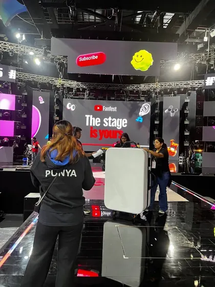 Our team setting up props on the glossy stage of the YouTube Fan Fest. We handle all stage changes quickly and efficiently.