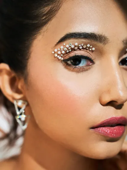 A closer view of the crystal eye makeup, showing the detail and artistry involved. Learning to work with embellishments is a key skill for a versatile artist.