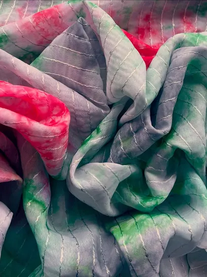 This Tabby Silk Tie-Dye fabric in shades of green and pink is perfect for creating breezy and beautiful outfits with a boho vibe.
