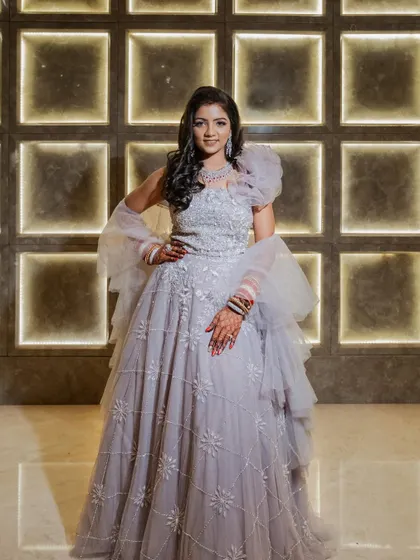 A princess moment. This bride looks ethereal in a lavender gown for her reception, with makeup and hair styled to match the dreamy vibe.