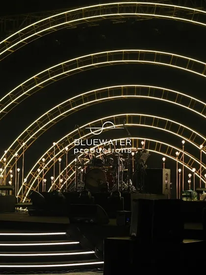 The Sangeet stage comes to life, with the band setting up within the glowing arches, ready to kick off an unforgettable evening of music and dance.