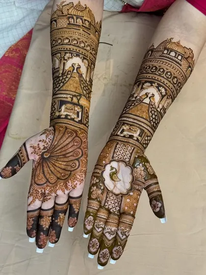 A full view of the matching bridal arms, with palace architecture and peacocks creating a symmetrical and royal look.