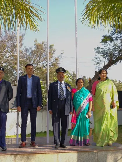 Our school's leadership and esteemed guests stand at attention during the Republic Day flag hoisting ceremony.