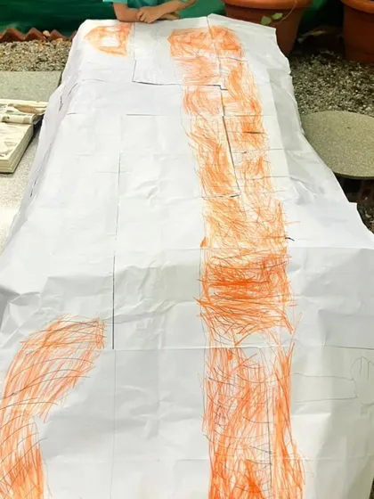 More scenes of mathematics in action, from children measuring themselves against a chalkboard to creating secret rooms of math puzzles. These images show how math is a joyful, creative, and collaborative language at our school.