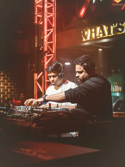 Here's a closer look at our collaborative set. We're both in the zone, mixing and layering tracks together to create a unique live sound.