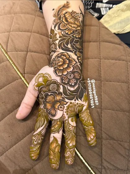 Another angle of the 3D floral work, showing how the pattern extends up the arm with a mix of bold flowers and delicate details.