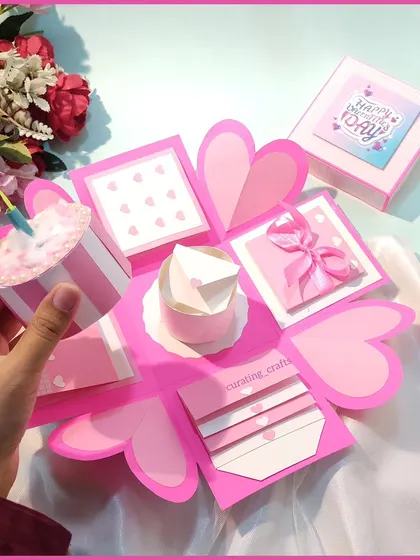 A close-up of the pop-up cake detail inside the explosion box. It adds an extra layer of celebration to the surprise.