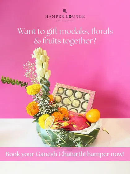 Welcome Bappa with a gift that combines all his favorites. This Ganesh Chaturthi hamper includes a box of traditional modaks, fresh fruits like dragon fruit and orange, and a beautiful arrangement of marigolds and tuberoses in an eco-friendly leaf basket.