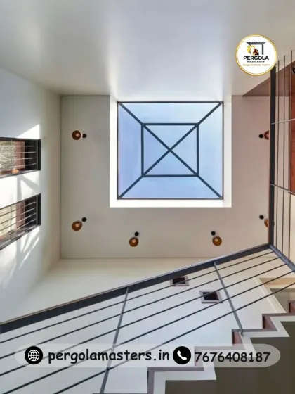 A look from below at one of our minimalist skylight designs. Installed at the top of a staircase, this square pyramid skylight floods the multi-level space with natural light, reducing the need for artificial lighting and creating a sense of openness and height.
