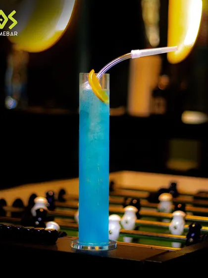 Hop over for a Bullfrog LIIT. This vibrant blue cocktail, served in a tall glass, is the perfect jumpstart to your night of games and fun.