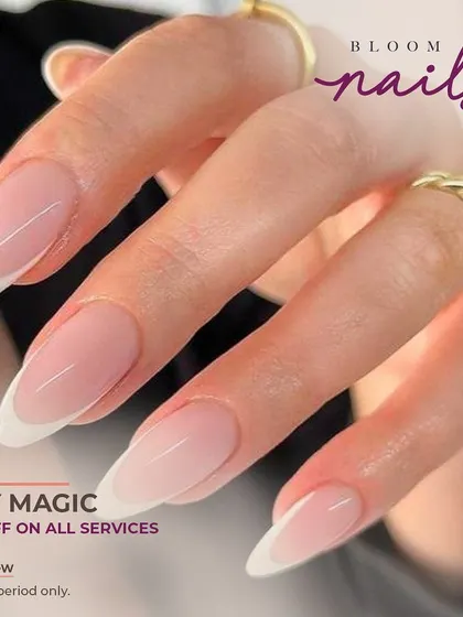 The classic French manicure on long, almond-shaped nails is always a sophisticated choice.